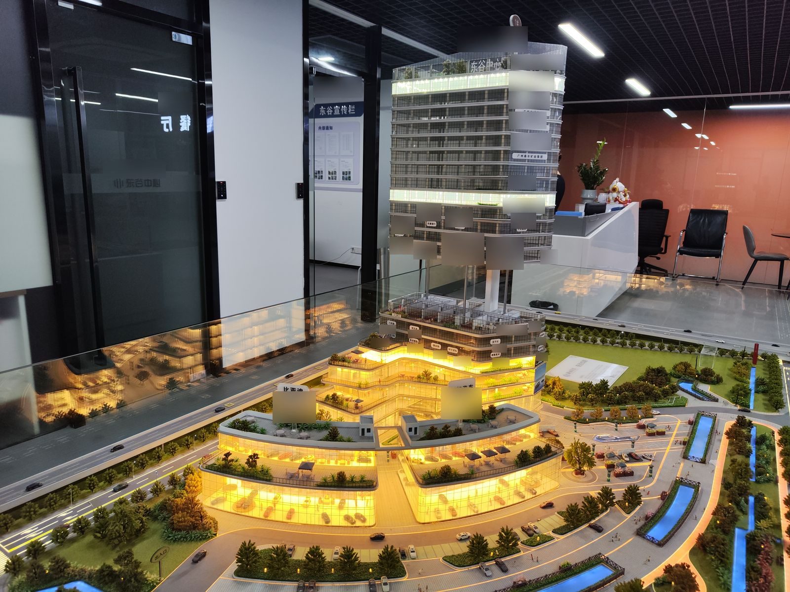 Cut-away multi-storey commercial building model with interior lighting