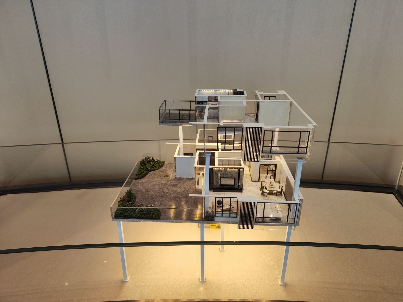 Multi-storey house section model showing floor slabs, balconies and furnished rooms