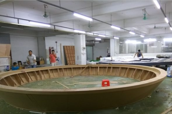Empty workshop with a large circular model base in progress