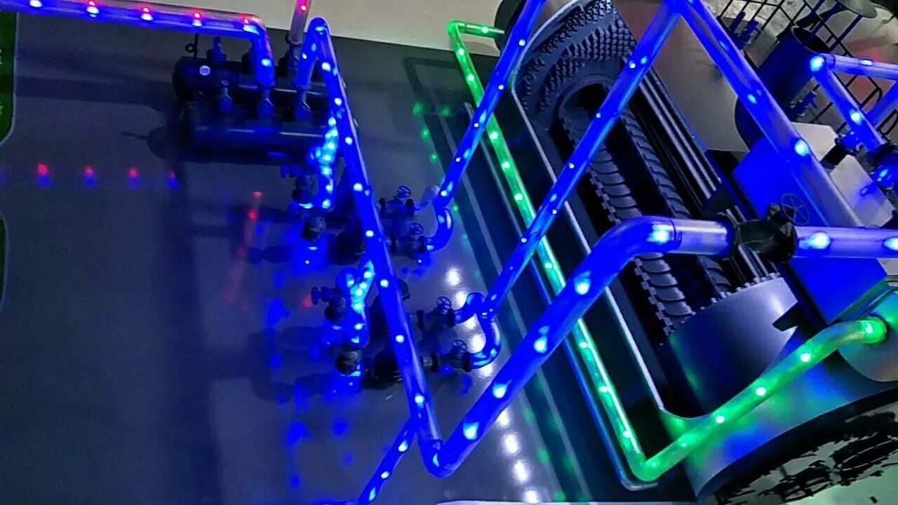 Close-up of blue and green model lighting channels on a plant model